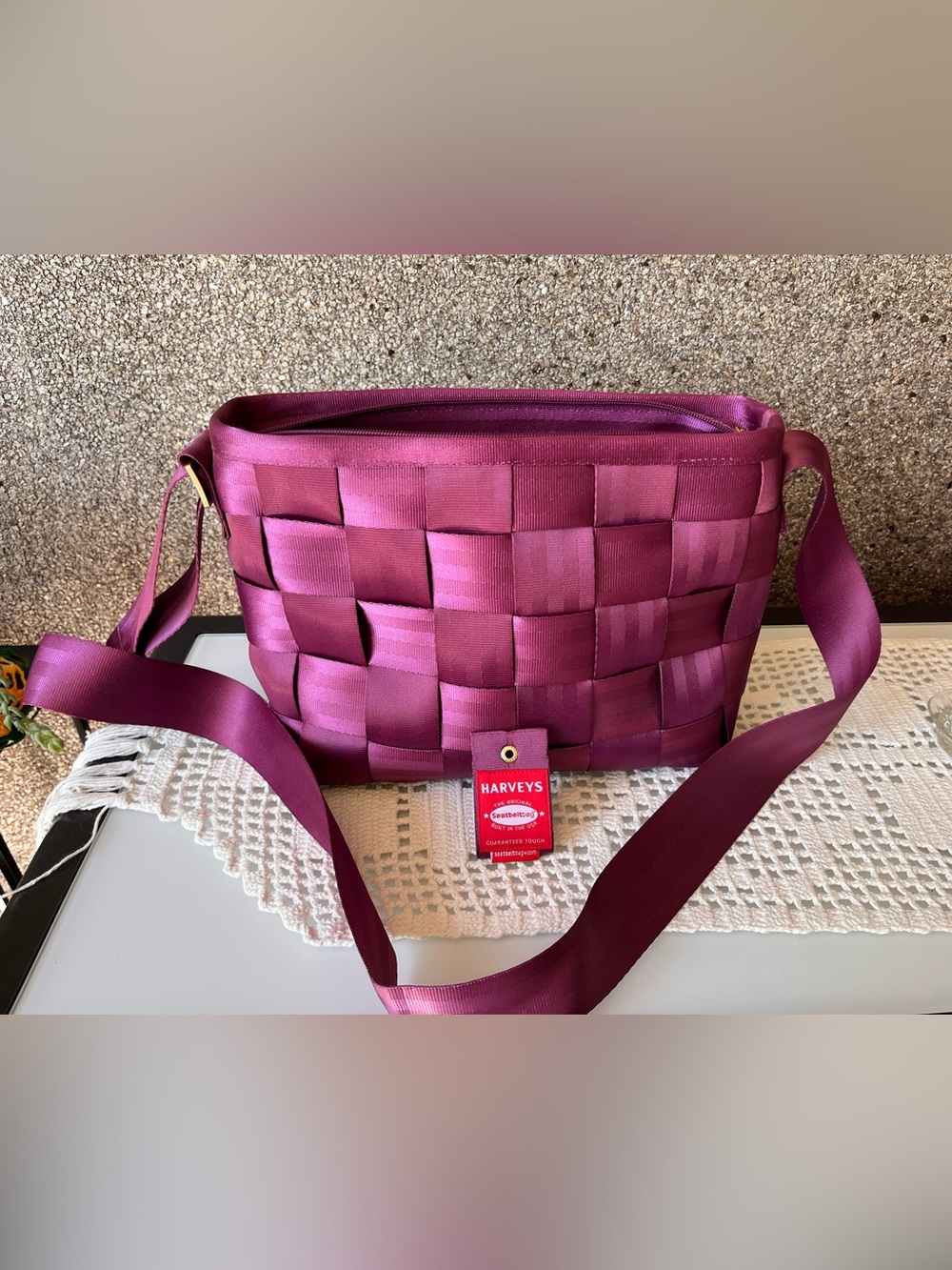 Harveys Woven Seatbelt Crossbody Bag in Berry Plum purple pink colour